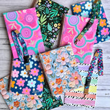 2027 Teacher Planner Essentials Bundle showing a selection of colourful planner, Assessment & Record Book and teacher lanyard designs